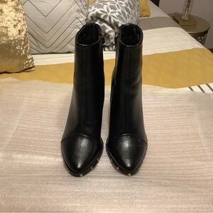 Sleek Black Heeled Boots with studs and zip sides